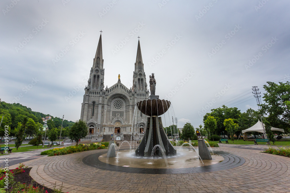 Beautiful fountain in front of the majestic Basilica of Sainte-Anne-de-Beaupre, Cathedral, Quebec an important Catholic sanctuary.