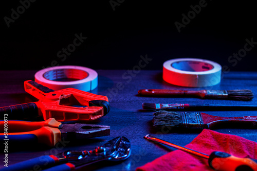 Conceptual photo of hand tools and brushes