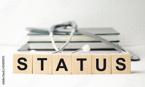 Wooden word on wooden table background concept - Status