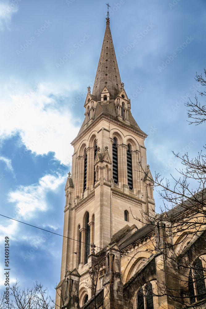 Steeple tower of the Eglise Notre Dame de bergerac church, the main catholic church, neogothic, built in the 19th century in Bergerac, a city of Dordogne, in Perigord, in France...