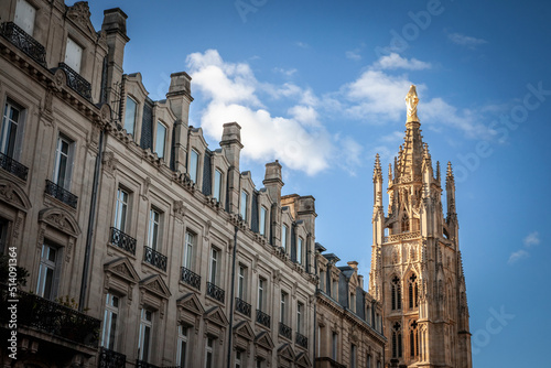 Tour Pey Berland tower seen from an old bordeaux street with residential buildings. Pey Berland Tower is the steeple bell tower of the Cathedrale Saint Andre Cathedral in Bordeaux, France... © Jerome