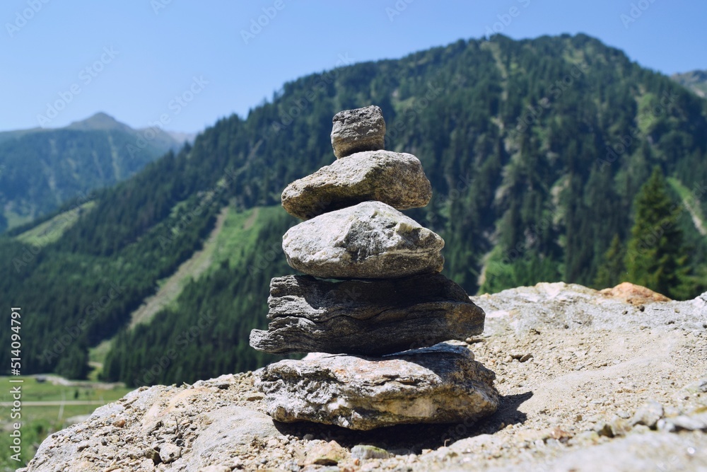 Zen stone pile in the rocky mountain landscape Zen stone pile in the rocky mountain landscape