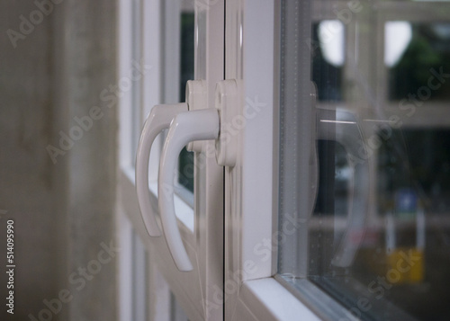 White minimalist door handle. Door handle
