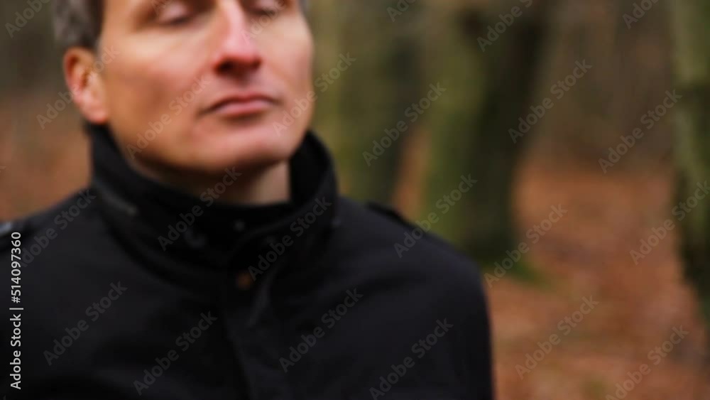 Close up of criminal firing a pistol in a forest Close up of criminal firing a pistol in a forest