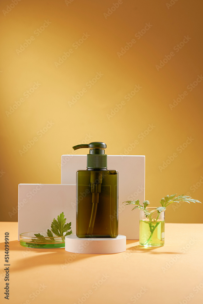 Front view of mugwort ( artemesia vulgaris ) decorated in petri dish glassware white podium cosmetic jar and brown background