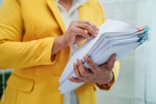 Businessman working and prepare paperwork report data to analysis information in file binder at office.