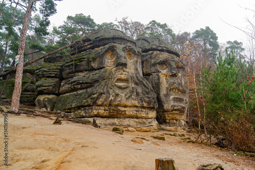 Heads carved into rock. Monument , history, nature, park.