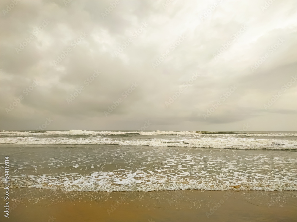 Clouds over the beautiful waves on sea