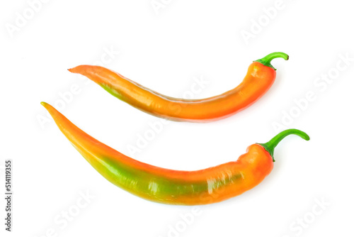 Canvas Print Two spicy multicolored pepper on a white background with a shadow