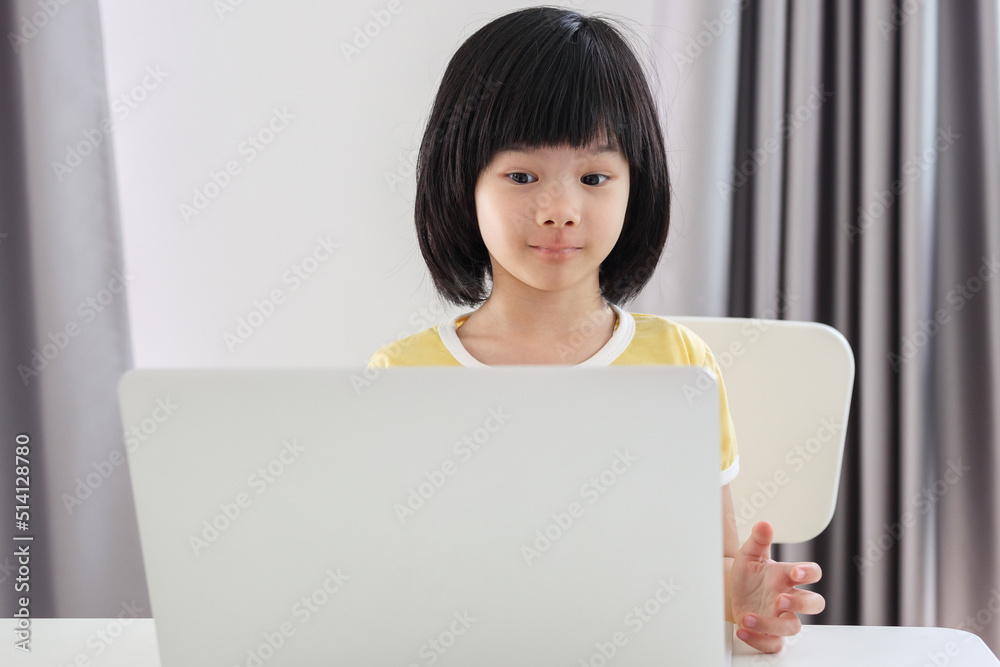 little asian girl student study online using laptop computer at home little asian girl student study online using laptop computer at home