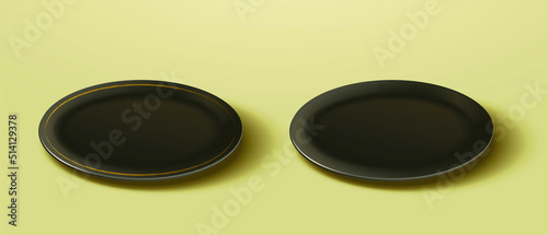 Two empty black plates