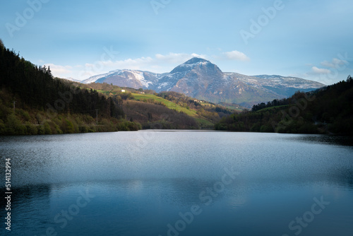 Ibiur reservoir with Txindoki mountain as background, Basque Country in Spain