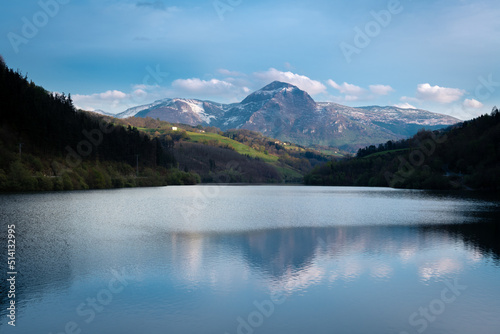Fototapeta Naklejka Na Ścianę i Meble -  Ibiur reservoir with Txindoki mountain as background, Basque Country in Spain