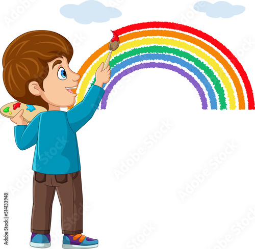 Cute little boy painting and drawing rainbow on the wall