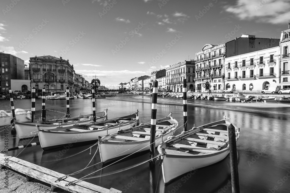 Typical Sète boats on the royal canal, black and white, in Sète, in Hérault, in Occitanie, France