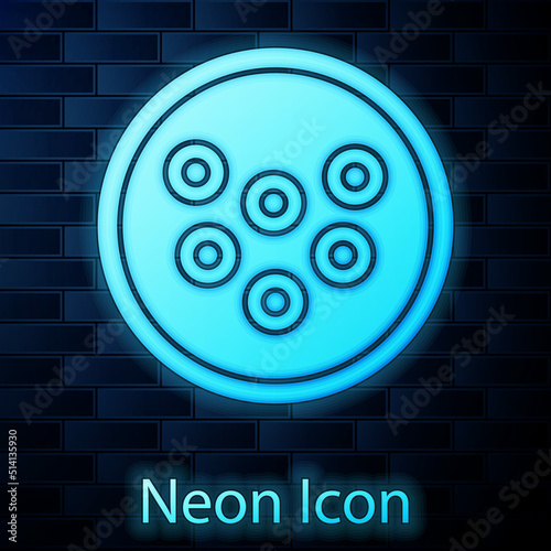 Glowing neon Caviar on a plate icon isolated on brick wall background. Vector.