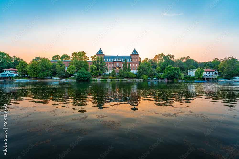 Scenic view of the Po river at dusk with the Valentino Castle on the riverbank in Turin, Italy