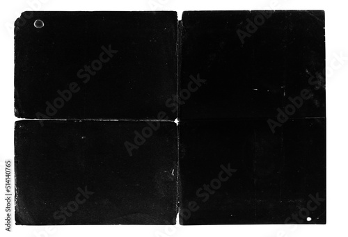 Texture of old crumpled paper with jagged torn edges, stains, scuffs and holes, old black overlay texture, crumpled dirty paper with fold lines photo