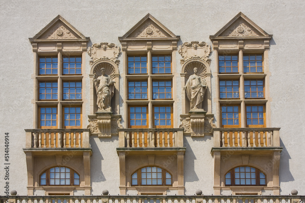 Neo-renaissance facade of the building of Adam Mickiewicz University and Monument to Adam Mickiewicz in Poznan, Poland
