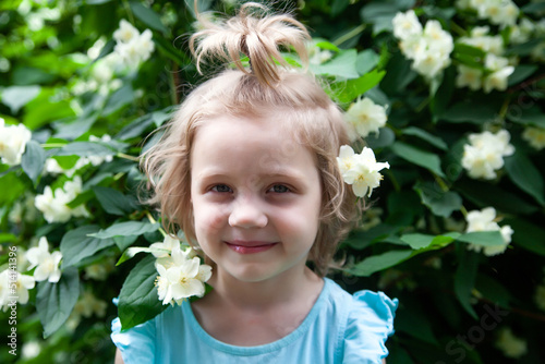 Wallpaper Mural Cute blonde baby girl near jasmine bush Torontodigital.ca
