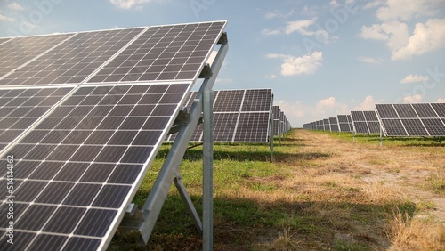Solar panels against deep blue sky. Solar cells farm. Photovoltaic modules for renewable energy. Save the earth, energy with good environment concept. © Volodymyr