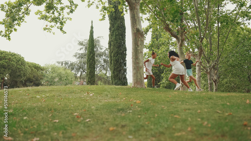 Three girls friends pre-teenage playing Hide-and-seek. Teenage girl counting with closed eyes while others run away