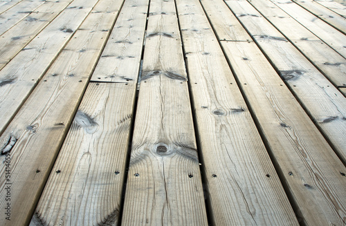 Wooden plank on jetty in closeup.