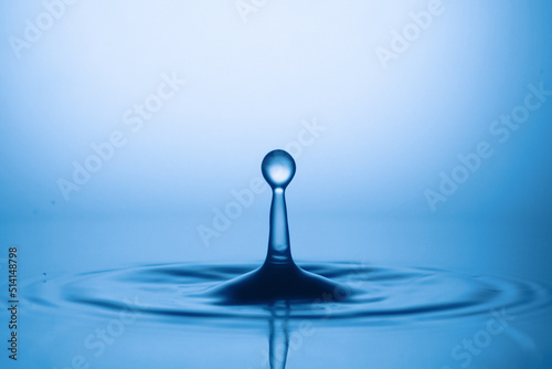 Drops of water and splashes. Blue splash water drop, round water drop, water drop in glass, drop, splash, spray, abstract shape out of water . Water shape abstract background concept.