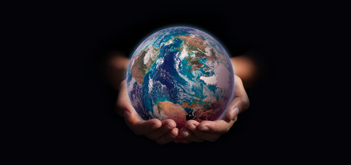 earth in hands. green planet on hand. save of earth. environment concept for background web or world guardian organization.Elements of this image furnished by NASA