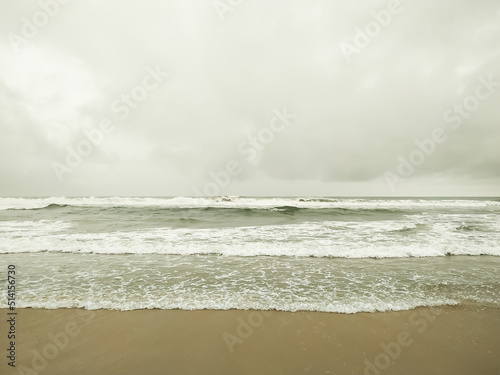 Bubbles white waves on the beach texture background