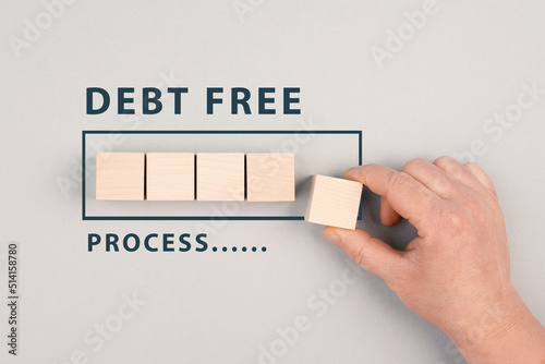 The words debt free in process are standing next to the loading bar, ending credit payments and bank loans, financial freedom