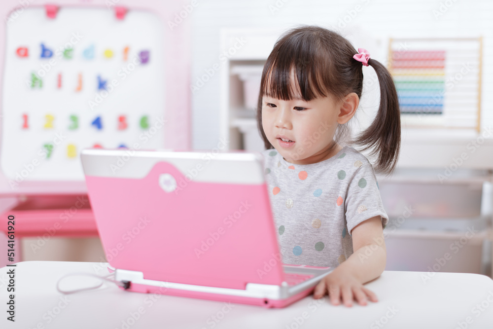 young girl using laptop for online learning during lockdown time young girl using laptop for online learning during lockdown time