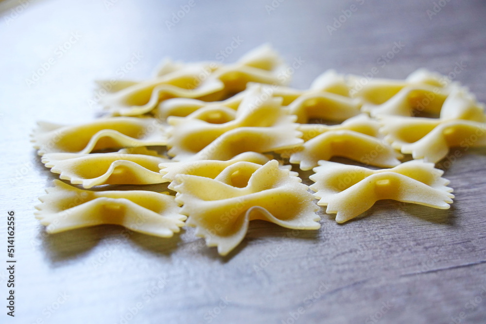 Almaty, Kazakhstan - 03.30.2022 : Dry pasta is laid out on the kitchen table. Almaty, Kazakhstan - 03.30.2022 : Dry pasta is laid out on the kitchen table.