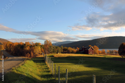 Panorama of the Norwegian countryside. Sunset of a field near the fjords and alps in northern Norway.