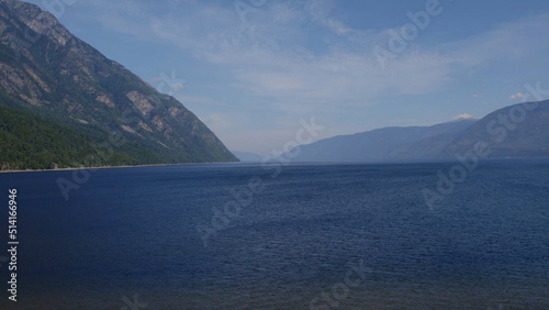 Lake Teletskoye between mountains with blue clear sky in Altai © TravelFlow