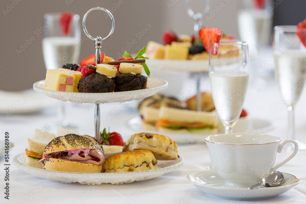 A delightfully decadent champagne afternoon tea - obrazy, fototapety, plakaty 