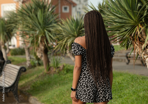 View from back of girl with rblack dreadlocks from kanekalon. photo