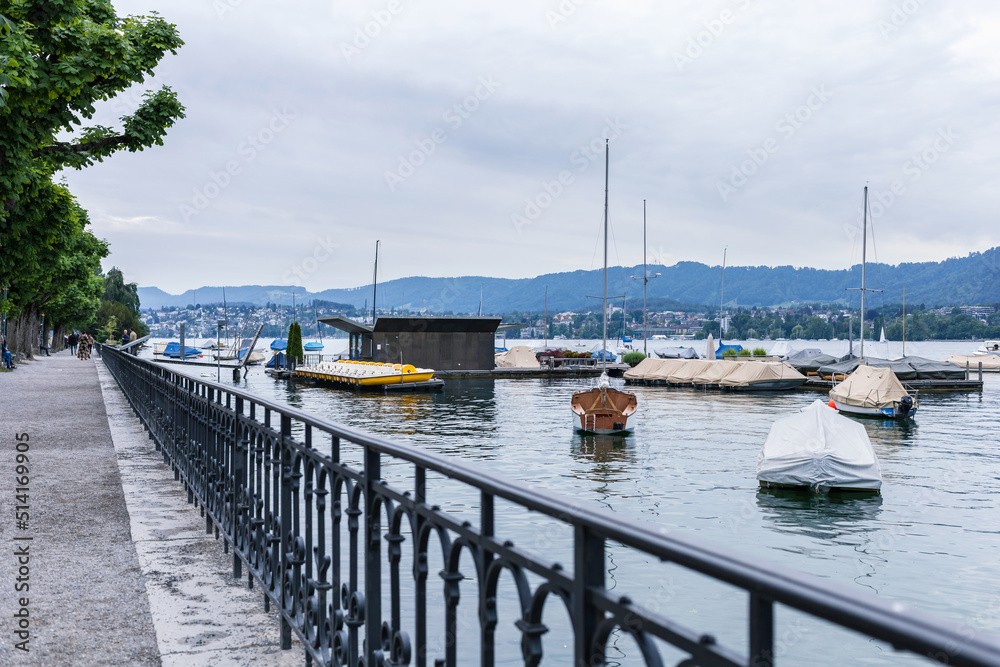 atmosphere of lake Zurich on weekend or day off, boat on lake