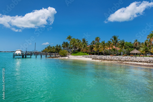 Sunset Beach and pier in beach state park and palm trees in Florida Keys