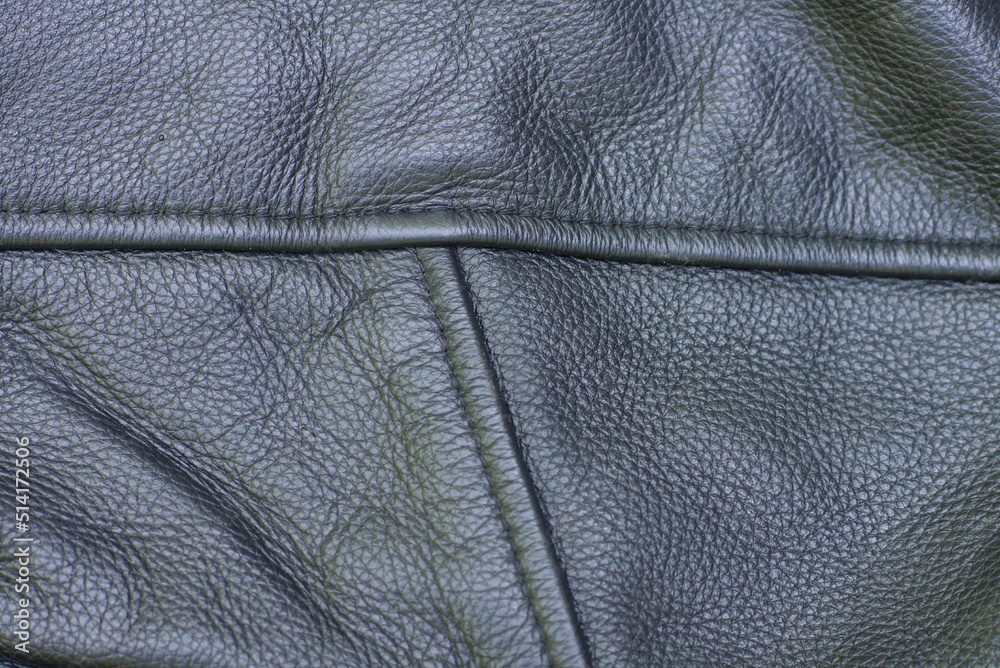 Fototapeta premium texture of fashionable leather black jacket with seams