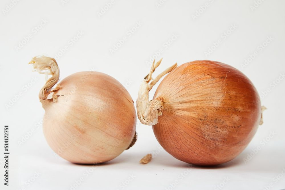 Fototapeta premium Ripe fresh onion on a white background