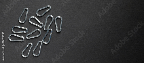 4mm climbing carabiner isolated against a dark background photo