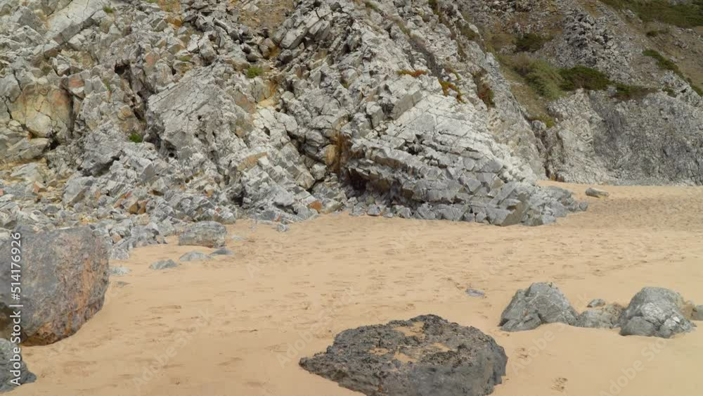 Grey Colour Cubic Form Stones in Beach near Gruta da Adraga Mountain Caves Grey Colour Cubic Form Stones in Beach near Gruta da Adraga Mountain Caves