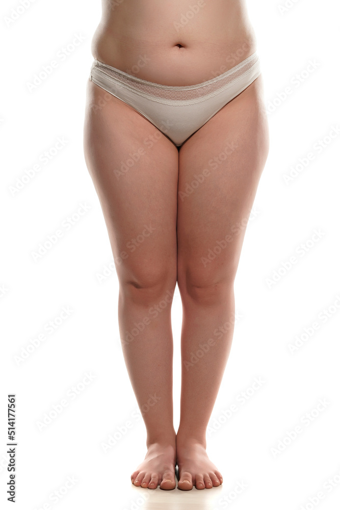 Front view of overweight woman with fat cellulite legs and belly, obesity female body, white background