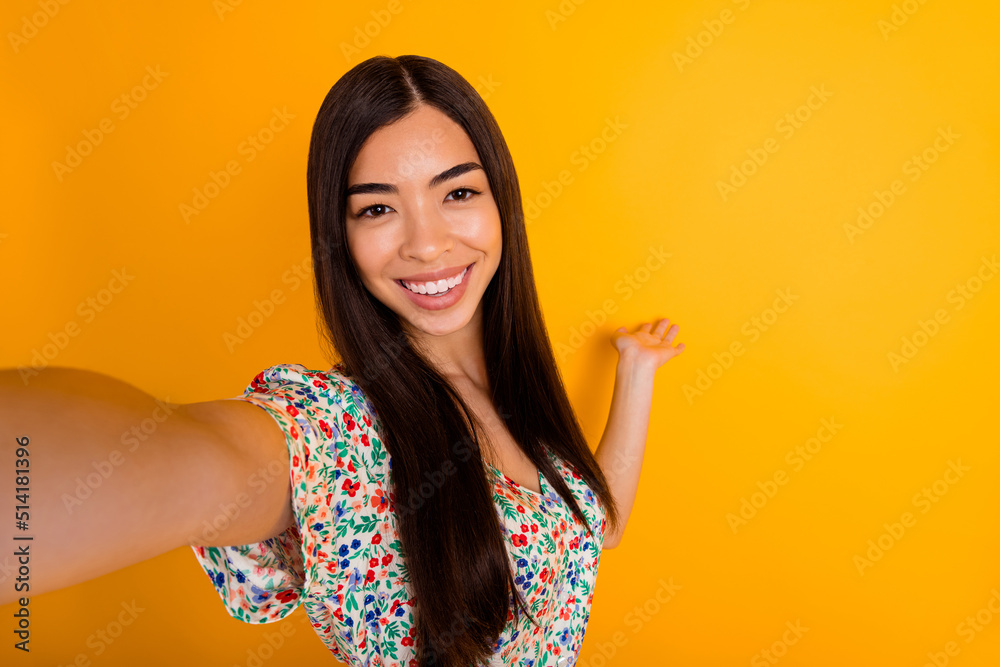 Photo of pretty positive lady arm palm demonstrate empty space way isolated on yellow color background Photo of pretty positive lady arm palm demonstrate empty space way isolated on yellow color background