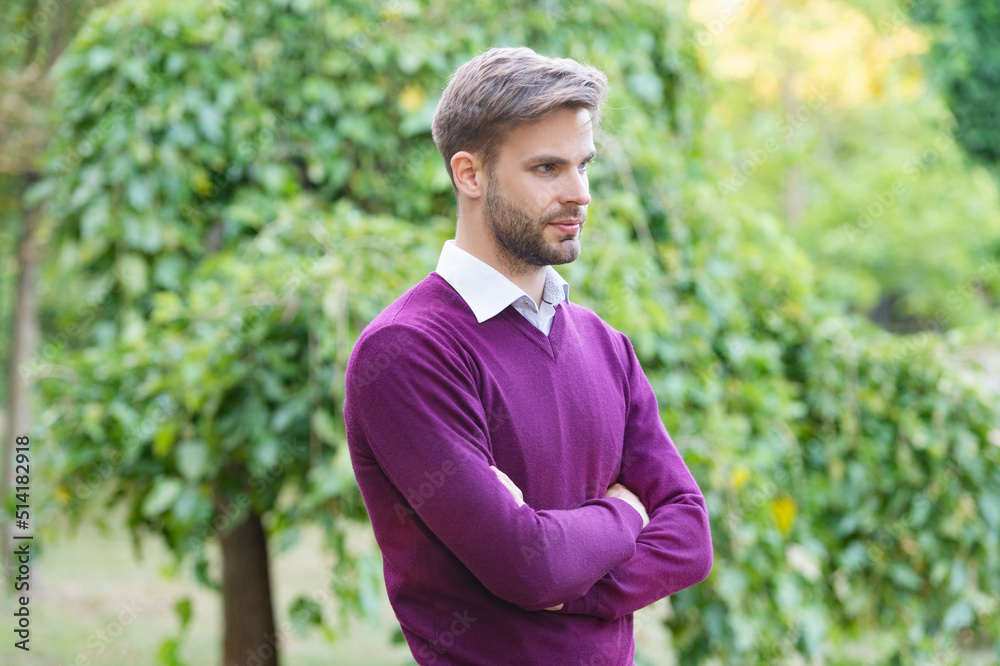 young handsome man in casual style crossed hands outdoor young handsome man in casual style crossed hands outdoor