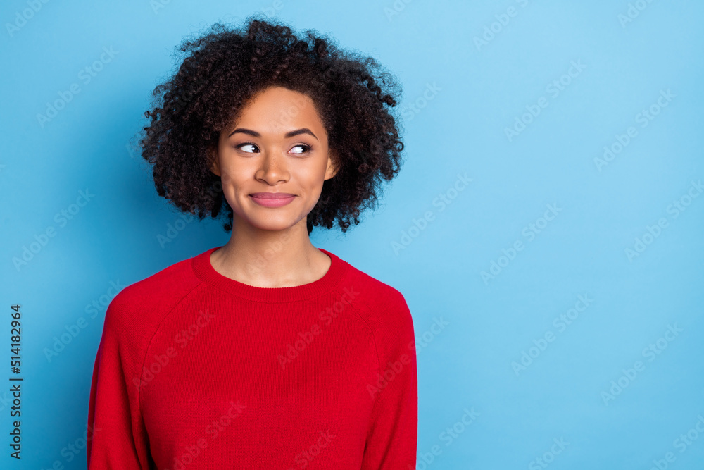 Photo of funky dreamy young lady dressed red pullover looking empty space isolated blue color background Photo of funky dreamy young lady dressed red pullover looking empty space isolated blue color background