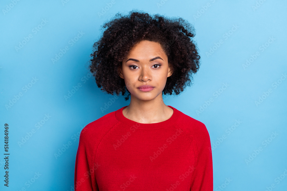 Photo of serious confident young woman wear knitted sweater smiling isolated blue color background Photo of serious confident young woman wear knitted sweater smiling isolated blue color background