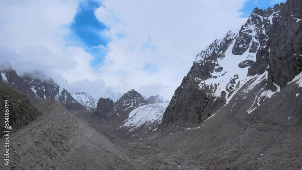 Drone flight among the snowy peaks of the mountains Drone flight among the snowy peaks of the mountains