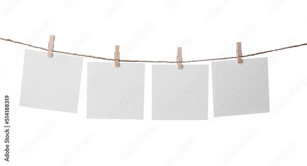 Clothespins with empty notepapers on string against white background. Space for text Clothespins with empty notepapers on string against white background. Space for text
